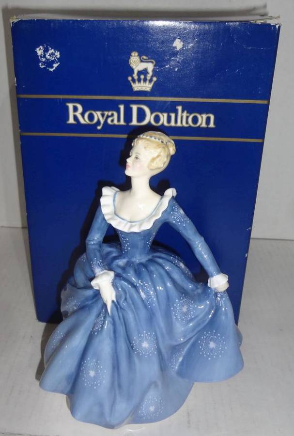 A Lovely Royal Doulton Figurine Vintage 1969 With A Blue Dress Dotted With  Stars and Cuffs and Low-Cut Ruffles A Fetching Blonde Stands 8"H, With Box,  Good Condition Auction | 1BID