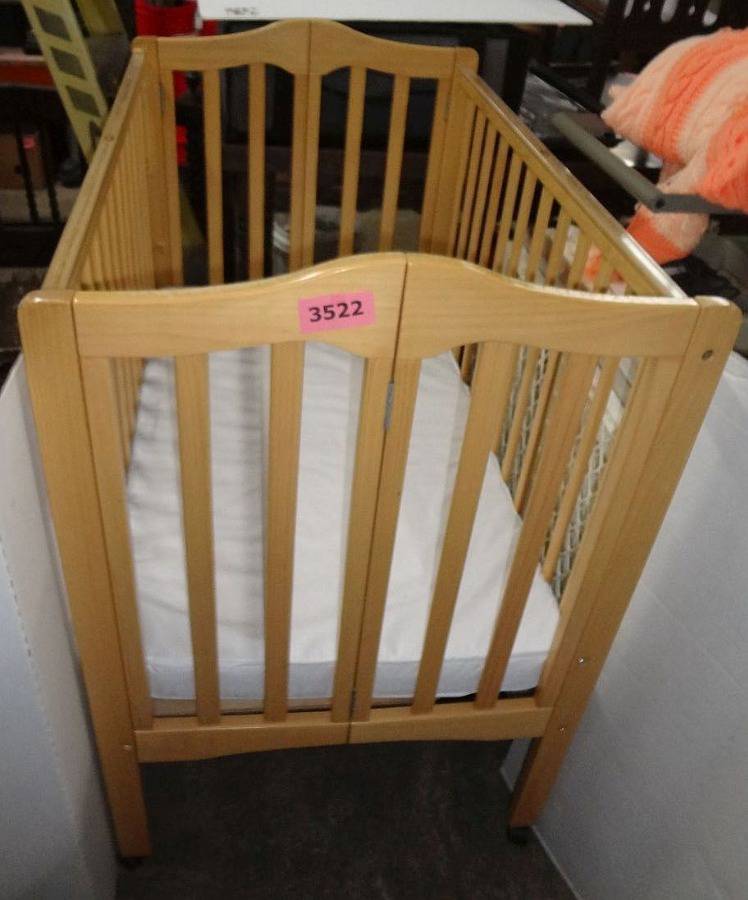 How thick should a crib best sale mattress be