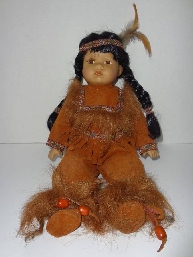 Ashley Belle Native American Indian Doll Porcelain Head Arms and Legs Glass Eyes Appears To Be In Sealed Position No Stains Very Good Condition Auction 1BID