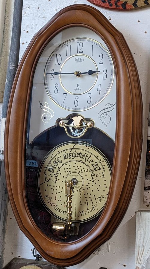 Small World Rhythm Disc Organette Wood Framed Wall Clock, Very