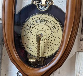 Small World Rhythm Disc Organette Wood Framed Wall Clock, Very