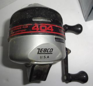 Two Fishing Reels, One Zebco 404, Closed Face And One Hemingway M-CD Fly  Reel By Cabela's, Both Look In Good Condition To Very Good Condition,  3Dia. Auction