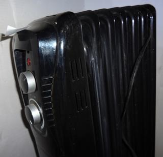 Mainstays Electric Radiator Heater, Model HO-0270B, 1500W Missing Front  Casters, As Is, Otherwise Looks in Good Condition, 6W x 12 1/2D x 24H  Update, Powers on. Auction | 1BID