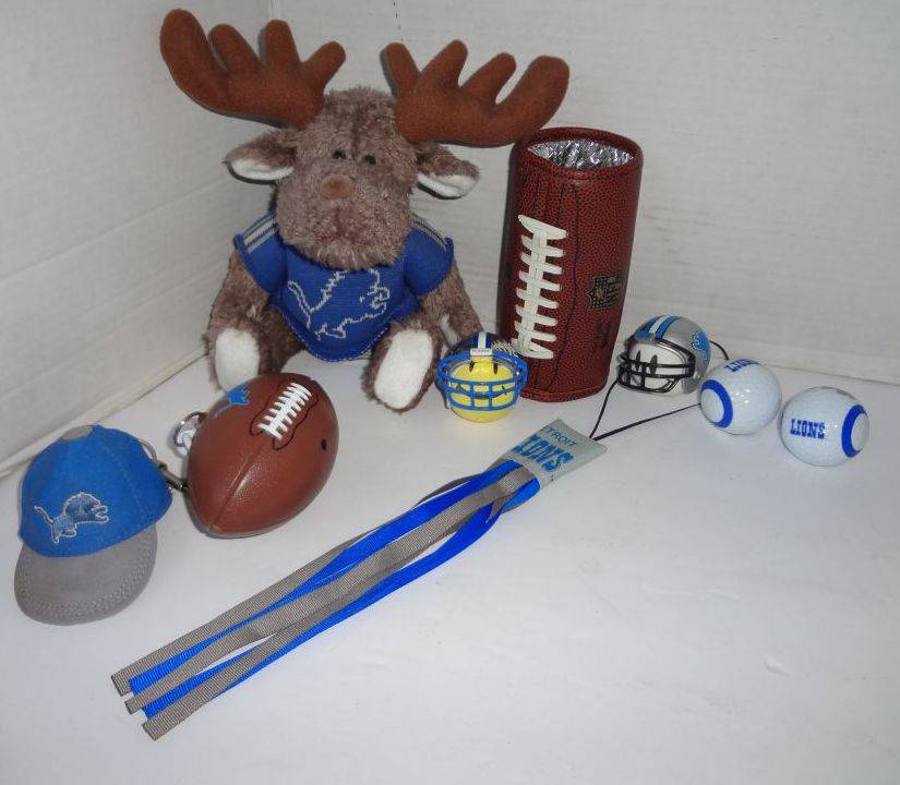 Detroit Lions Lot of Two Golf Balls, Leather Look Can Koozie, Two Antenna  Toppers, Football on Keychain, Rain Poncho, Stuffed Moose and Lions Ball  Cap Keychain, Up to 9'W x 7 1/2'H